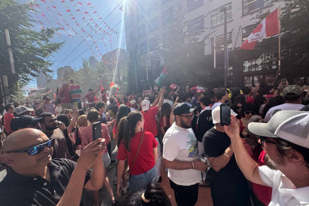 Revellers pour onto Granville Street after Canada crushed Qatar 6-0 in FIFA World Cup action June 18. (Lauren Collins/Black Press Media)
