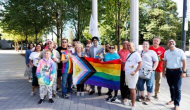 Members from various local 2SLGBTQIA+ pose for a photo with Surrey mayor Brenda Locke and Senator Baltej Dhillon before raising the progress Pride flag at City Hall on Friday, June 19, 2026. (Anna Burns/ Surrey Now-Leader)
