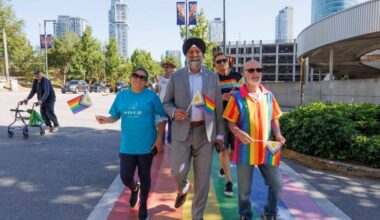 Members from various local 2SLGBTQIA+ walk across the Rainbow crosswalk in Surrey on Friday, June 19, 2026. (Anna Burns/ Surrey Now-Leader)