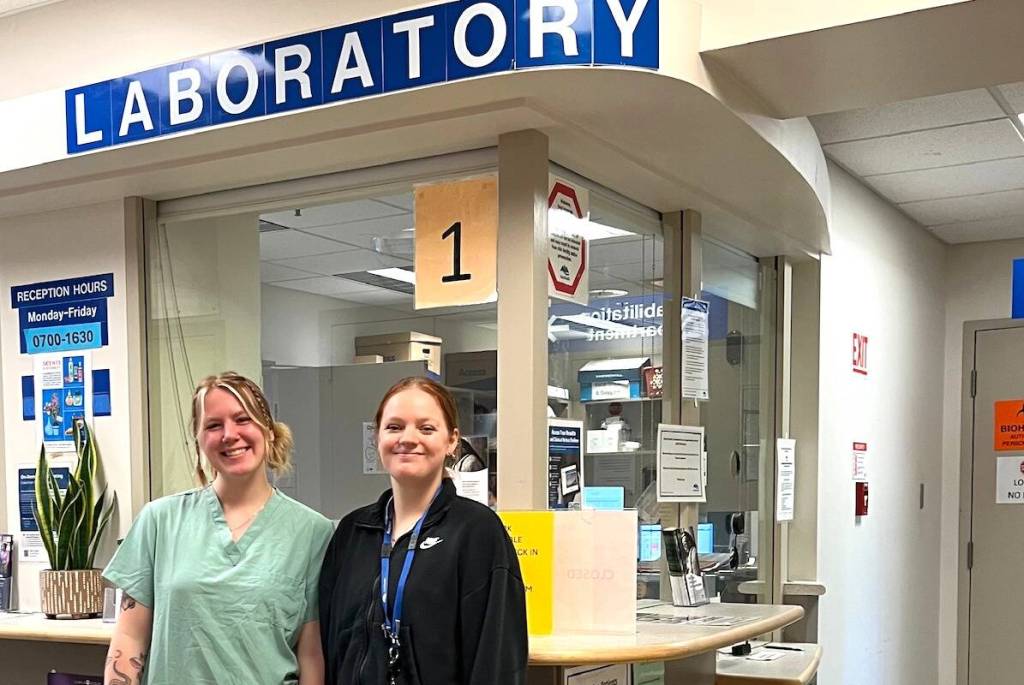 Medical lab assistants Hannah Green and Lily Squire at CDH lab. (Courtesy of Island Health)