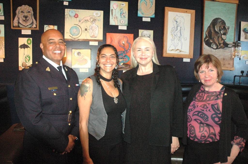 Government officials, RCMP officers and local business owners were on hand at the Nanaimo Bar lounge on June 22 for the announcement that the province is investing $16 million over two years for a program targeting repeat property crime offenders. Pictured, from left, are Insp. Donavan Tait, from The Nanaimo RCMP, Sonia Komen, owner/operator of The Nanaimo Bar, Public Safety Minister and Solicitor General Nina Krieger, and Shiela Malcolmson, MLA for Nanaimo-Gabriola. (Robert Barron/Nanaimo Bulletin)