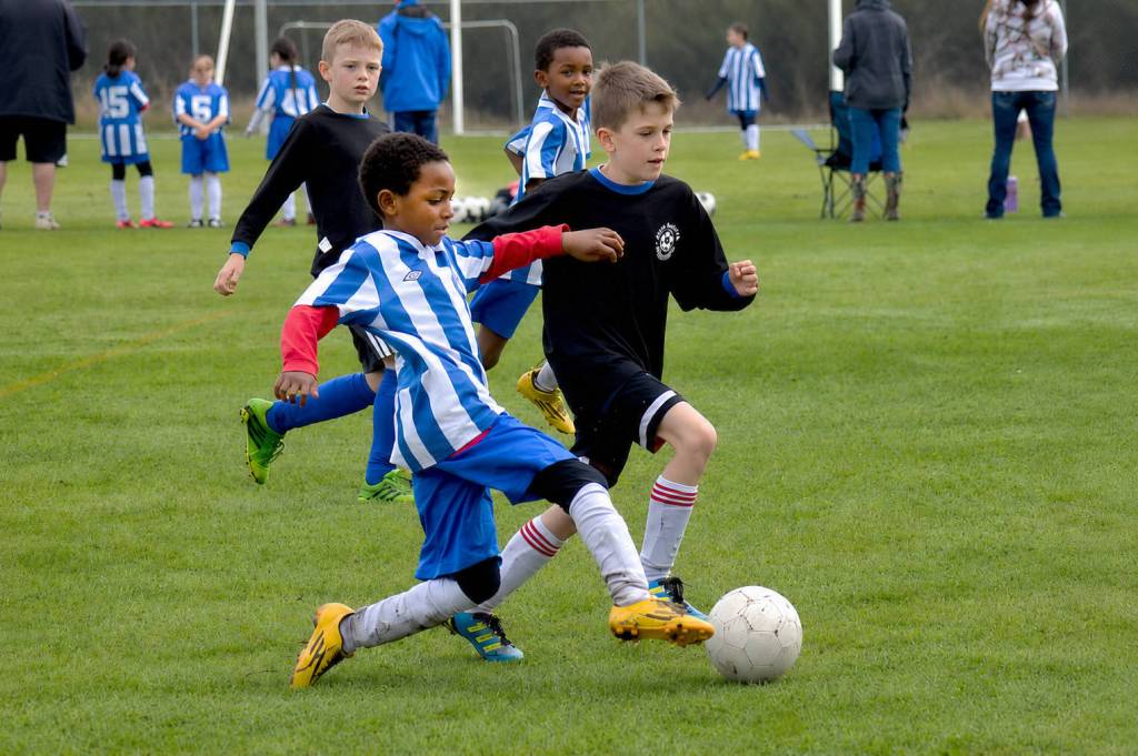 Young players compete during a Sooke Soccer Club game at Fred Milne Park. The club says families could face higher registration fees after its annual field-rental bill more than tripled. (Sooke News Mirror file photo)
