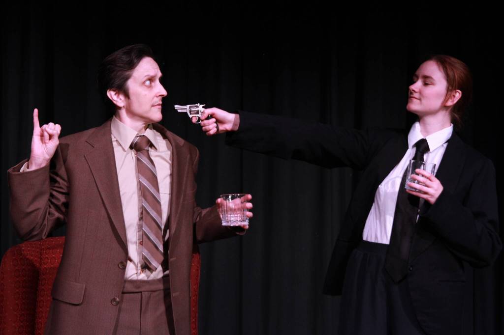Kay Knighting as Richard Hannay and Abigail Walkner, as one of numerous supporting characters, in a tense moment from White Rock Players Club&rsquo;s The 39 Steps at Oceana PARC Playhouse July 2 to July 19. (Contributed to Peace Arch News)