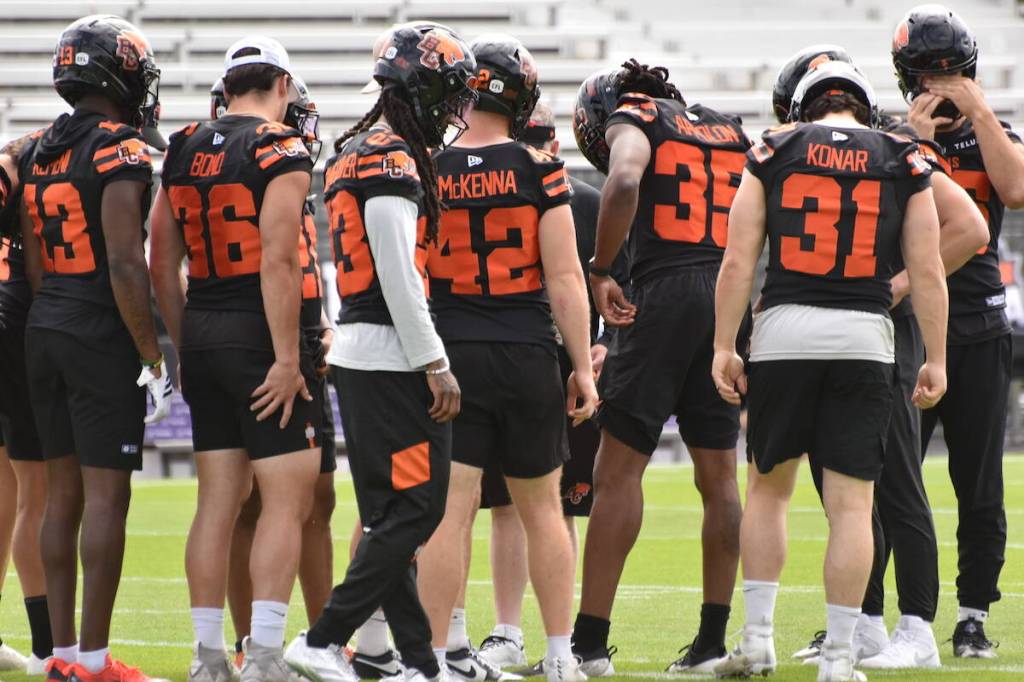 The BC Lions defensive line hits the gridiron in Kelowna on Friday morning (Brayden Ursel/Black Press)