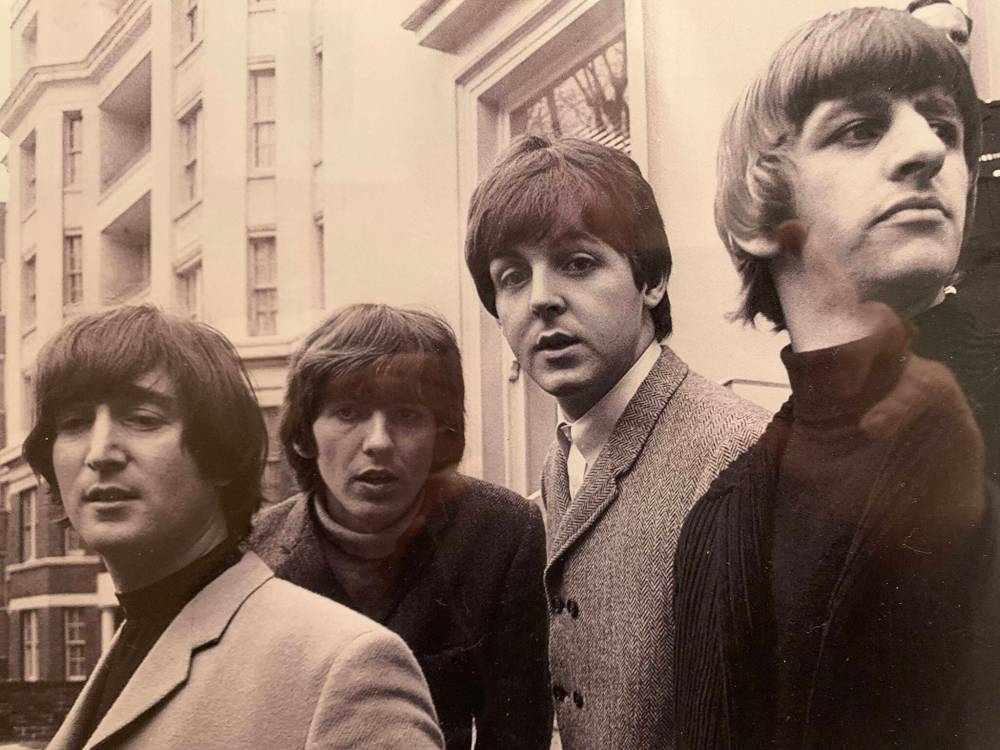 SUPPLIED
From left: When John got his driver’s licence in 1965, George, Paul and Ringo showed up to offer congrats.
