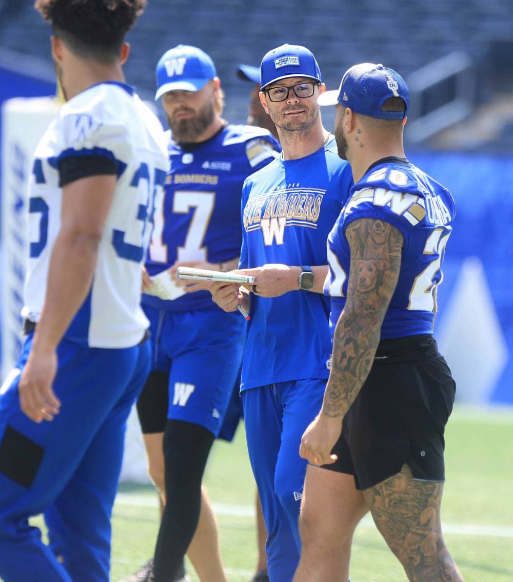 Ruth Bonneville / Free Press files
Winnipeg Blue Bombers running backs coach Jason Hogan (left) with Brady Oliveira, who Hogan helped reach his full potential during his first stint in the role.
