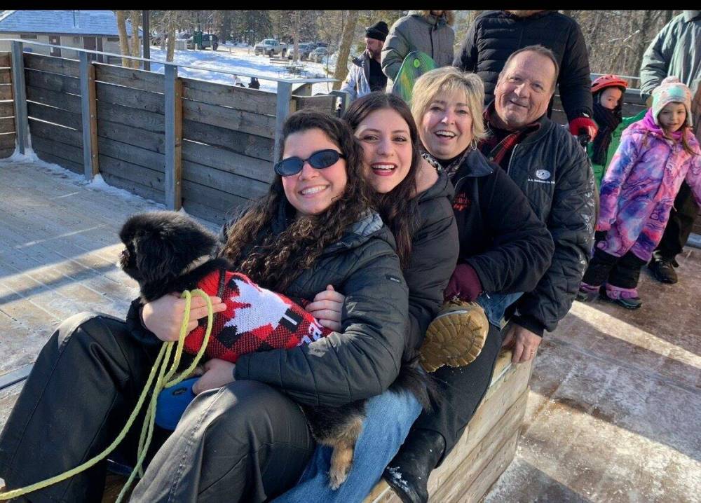 Supplied photo
Nina and Marc Lafleur are pictured here with Serena and Julia, two of the homestay students they have hosted in their St. Vital home. Louis Riel School Division — in the form of the International Student Program and LSRD Go Global — is inviting “community, colleagues and friends” to become part of its homestay program.