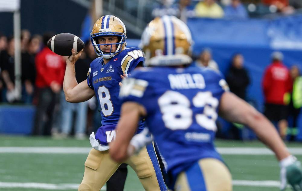 JOHN WOODS / THE CANADIAN PRESS
Winnipeg Blue Bombers receiver Tommy Nield (83) said his time spent with starting quarterback Zach Collaros (8) during the off-season laid the foundation as a target for the pivot that has already been evident through the club’s first two games of the regular season.