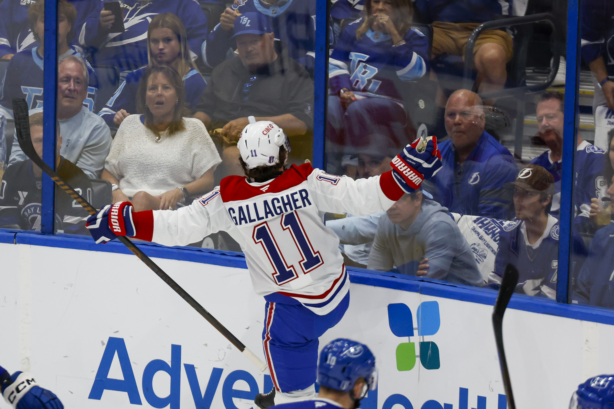 Brendan Gallagher celebrates facing the boards with lots of unimpressed Lightning fans on the other side.