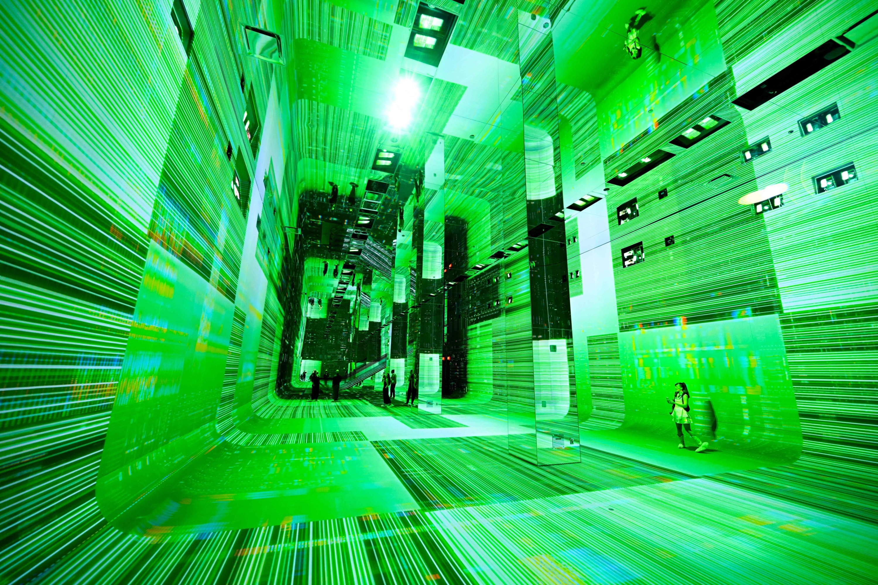 People walk through immersive visualizations from the inaugural exhibition Machine Dreams: Rainforest are projected at DATALAND, the Museum of AI Arts, Los Angeles, U.S., June 9, 2026. (AFP Photo)