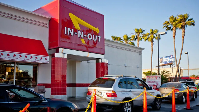 Los Angeles, USA - May 13, 2013: In-n-out Burger, fast food restaurant at Los Angeles Airport. Many cars are waiting in line to be served in drive-through part of restaurant.