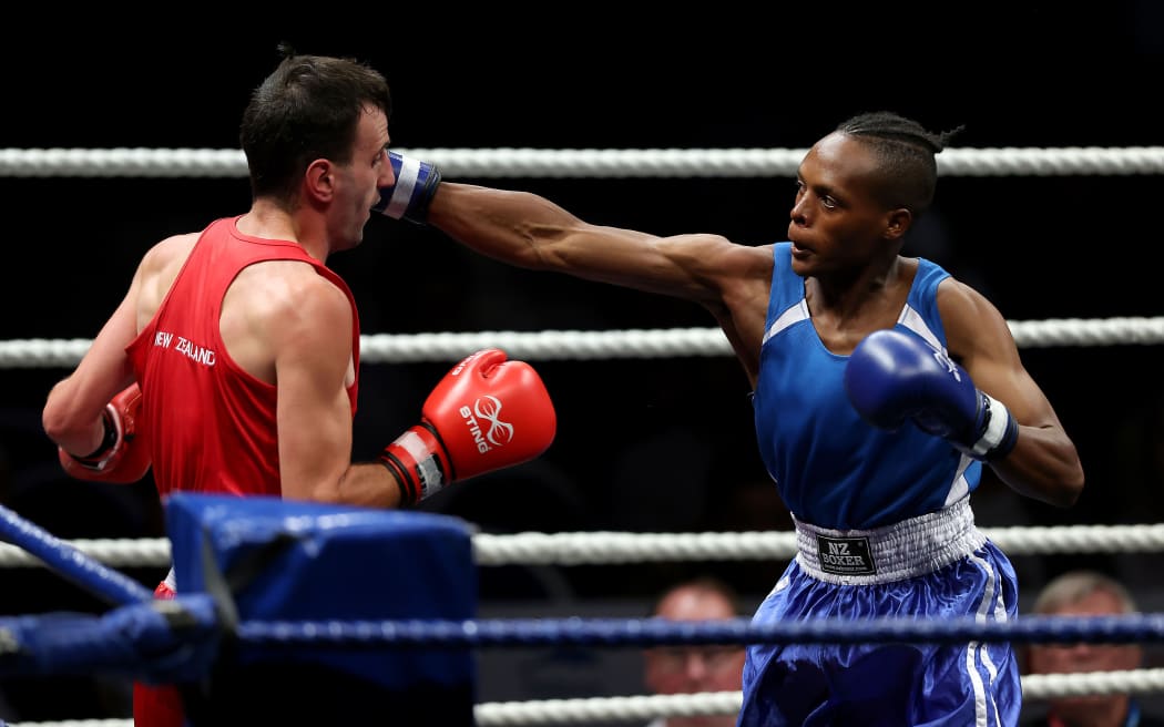 Lightweight Alex Mukuka (Blue) in action.
