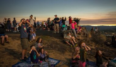 people gather to watch a total solar eclipse