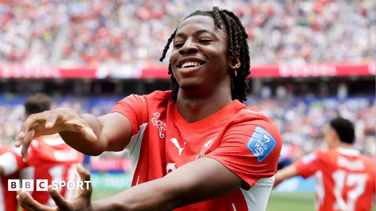 Johan Manzambi celebrates a goal by moulding his hands into a fireball shape