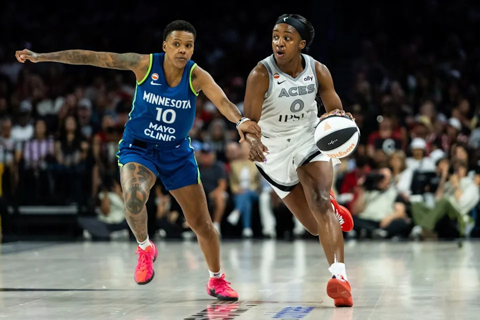 Las Vegas Aces guard Jackie Young (0) dribbles the ball up the court as Minnesota Lynx guard Courtney Williams (10) defends her during a WNBA game between the Las Vegas Aces and the Minnesota Lynx, Saturday June 13, 2026 in Las Vegas, Nev.