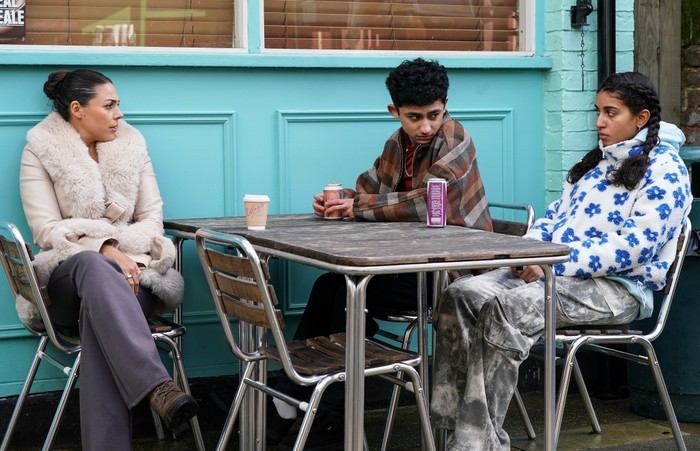 557202,TITLE:Eastenders Priya chats to Nugget and Avani outside the caff in EastEnders