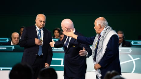 Palestinian football federation president refuses handshake with Israeli FA vice-president – video