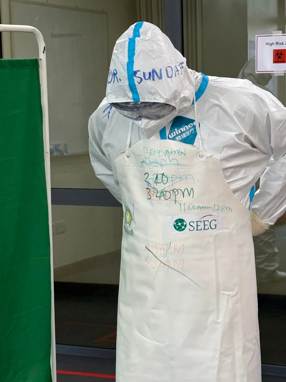 "Doffing" refers to the safe removal of protective gear and its disposal after spending time in the "red zone" of an Ebola treatment centre. African doctors practice the safety protocol during a training session led by experts from Berlin's Charité Hospital. Eva Krafczyk/dpa