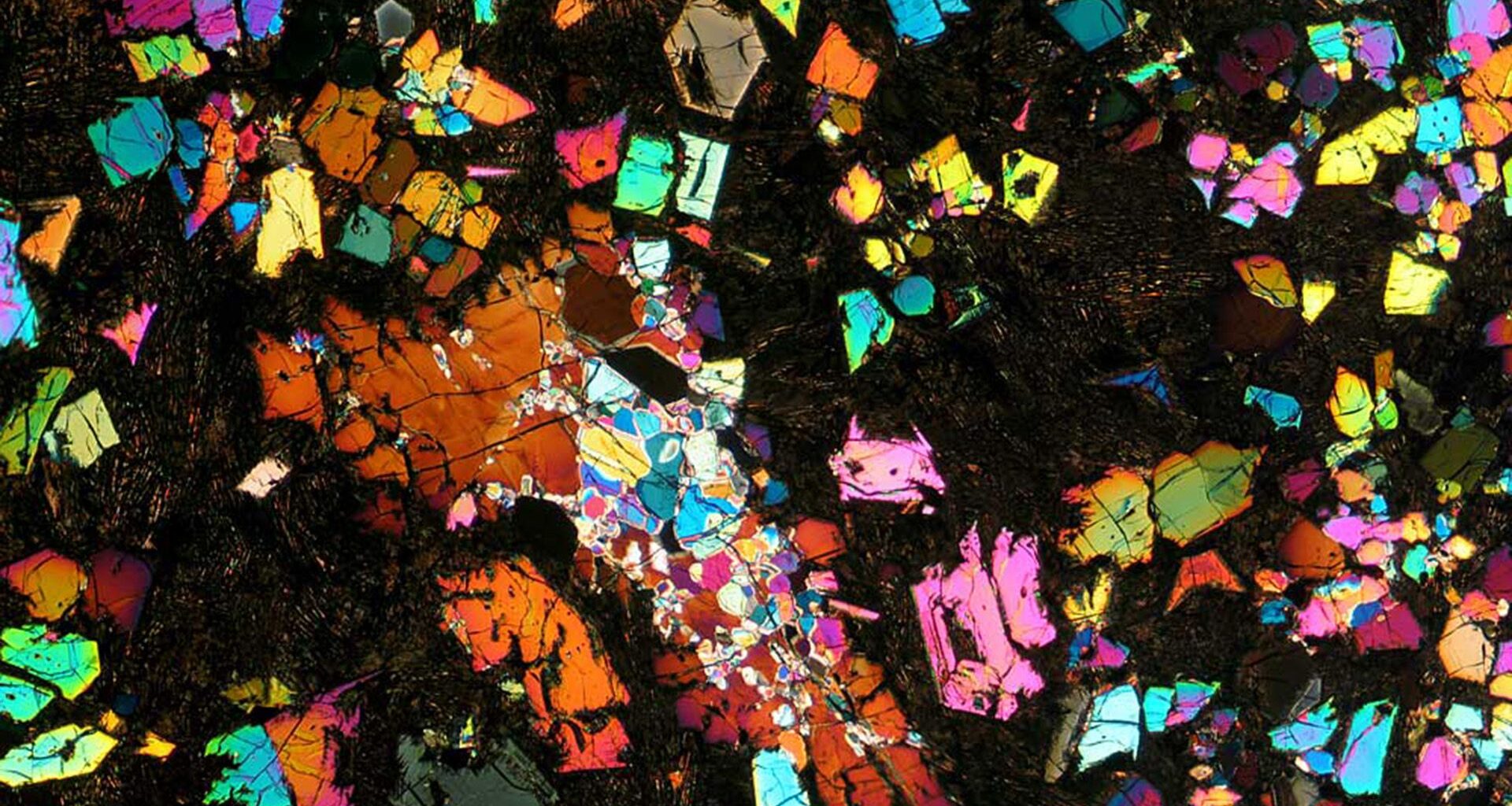 A kaleidoscope of colors is seen against a black background