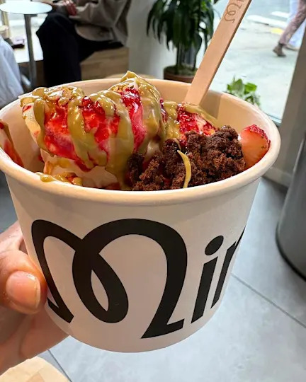 someone holding frozen yogurt from Mimi's