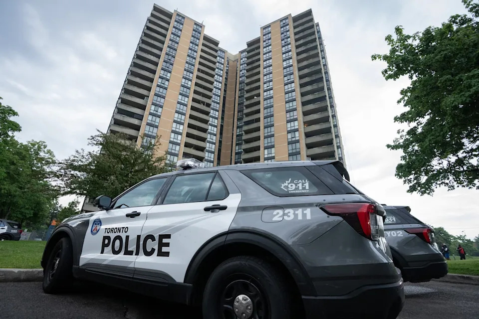 Investigators work the scene where a Toronto Police Officer was shot in Toronto on Thursday, June 11, 2026. THE CANADIAN PRESS/Arlyn McAdorey