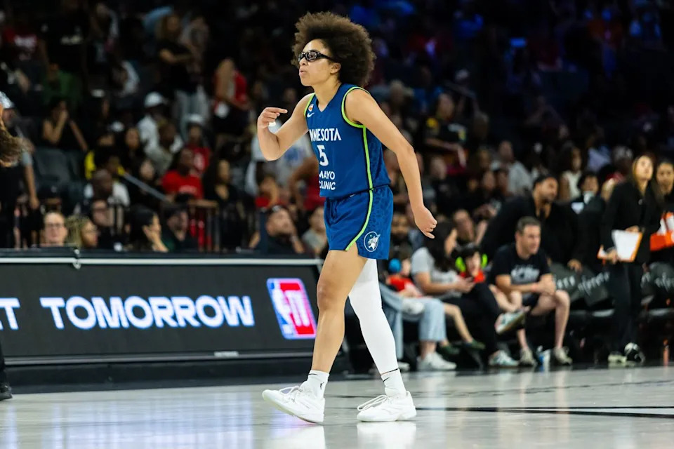 Minnesota Lynx guard Olivia Miles (5) points to herself in celebration after scoring a three-point shot during a WNBA game between the Las Vegas Aces and the Minnesota Lynx, Saturday June 13, 2026 in Las Vegas, Nev.