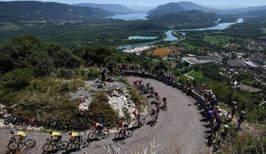 Red Bull - Bora - Hansgrohe's Australian rider Luke Tuckwell wearing the overall leader's yellow jersey (L) leads the pack of riders (peloton) in the ascent of the Lacets du Grand Colombier during the 7th stage of the Tour Auvergne-Rhone-Alpes cycling race (formerly known as the Criterium du Dauphine), 133,6km between La Bridoire and Grand Colombier in the French Alps on June 13, 2026. (Photo by Anne-Christine POUJOULAT / AFP)