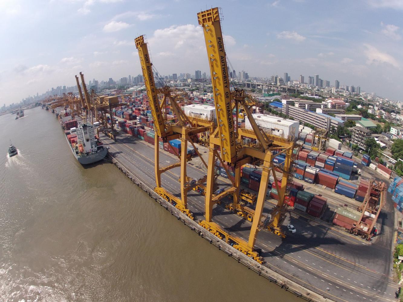 Large cranes work at the Bangkok port. For the first four months of the year, imports totalled $147 billion against exports of $128 billion, resulting in a cumulative trade deficit of $19.5 billion.