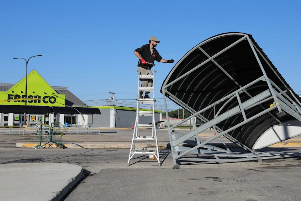 A shopping cart shelter at FreshCo on Pembina Highway and McGillivray Boulevard was damaged in Monday night's storm. The pic was taken June 30, 2026, as it gets work done.