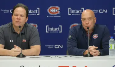 Photo of Montreal Canadiens GM Kent Hughes and Jeff Gorton at press conference.