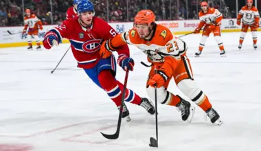 Anaheim Ducks center Mason McTavish (23) plays the puck against Montreal Canadiens defenseman Justin Barron (52) during the third period at Bell Centre.