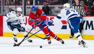 Tampa Bay Lightning center Conor Geekie (14) and defenseman Darren Raddysh (43) defend the puck against Montreal Canadiens right wing Patrik Laine (92) during the third period at Bell Centre.