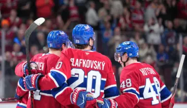 Montreal Canadiens forward Juraj Slafkovsky (20) celebrates with teammates forward Oliver Kapanen (91) and defenseman Lane Hutson (48) after scoring a goal against the Colorado Avalanche during the third period at the Bell Centre.