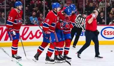 Montreal Canadiens center Alex Newhook (15) gets escorted off the ice after sustaining an injury against the Dallas Stars during the second period at Bell Centre.