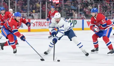 Toronto Maple Leafs forward Auston Matthews (34) plays the puck against Montreal Canadiens defensemen Mike Matheson (8) and Noah Dobson (53) during the third period at the Bell Centre.