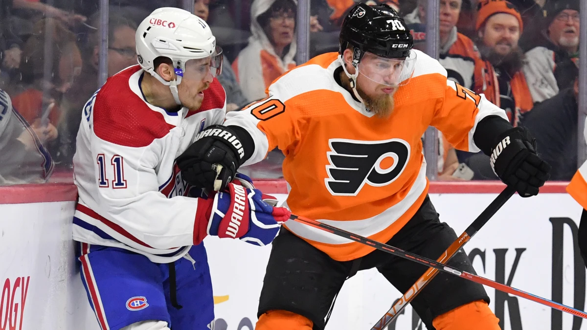 Philadelphia Flyers defenseman Rasmus Ristolainen (70) and Montreal Canadiens right wing Brendan Gallagher (11) battle behind the net during the first period at Wells Fargo Center.