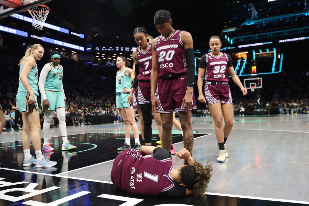 Toronto Tempo guard Kiki Rice (1) lays injured on the ground during the second half of a WNBA basketball game against the New York Liberty, Wednesday, June 3, 2026, in New York. (AP Photo/Heather Khalifa)