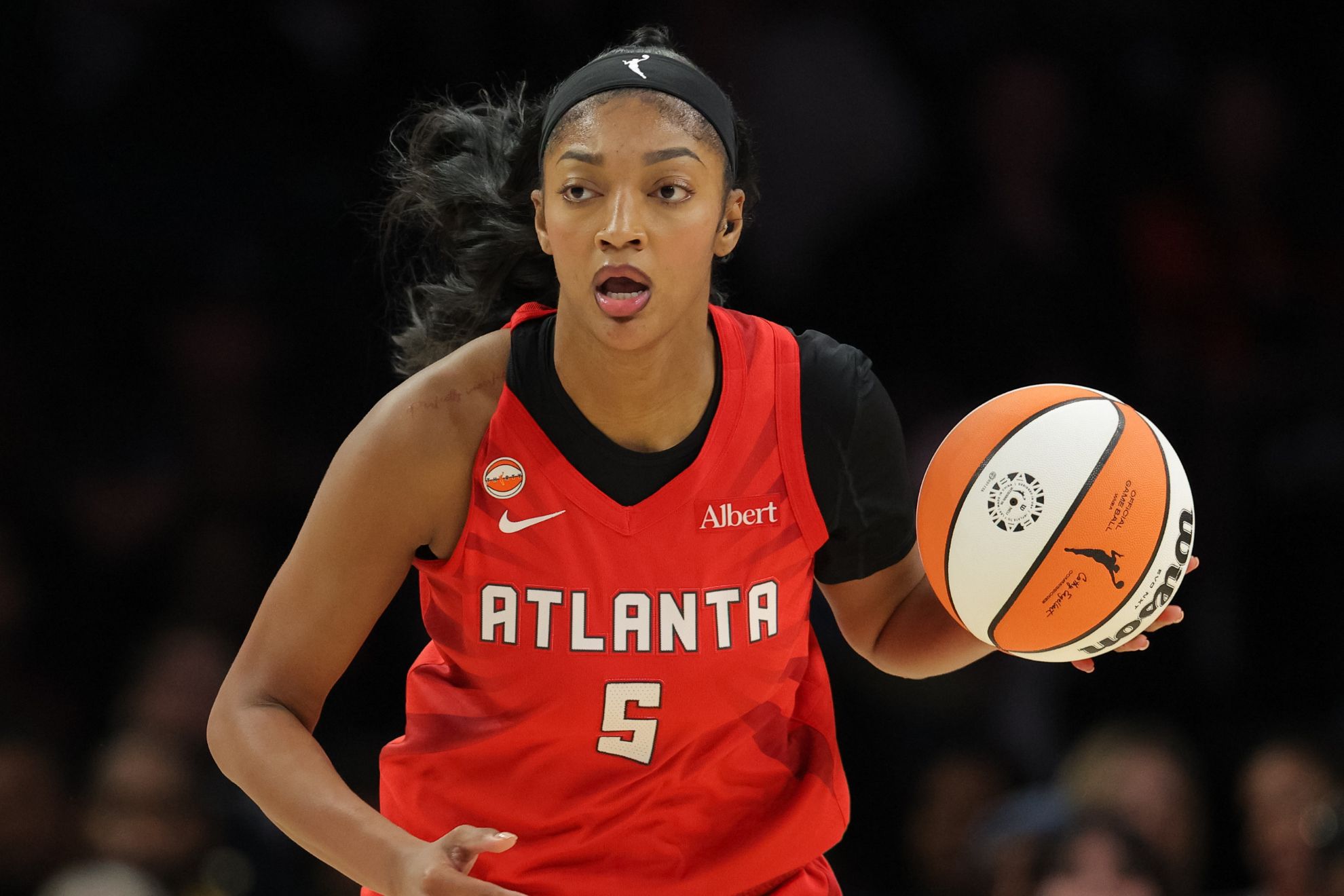 Atlanta Dream forward Angel Reese (5) dribbles up the court during a WNBA basketball