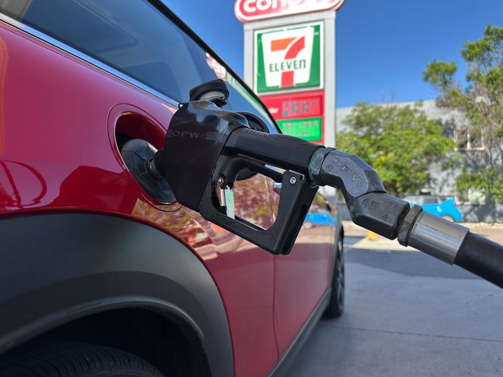 A motorist fills up the tank of a vehicle at a Conoco gasoline station Saturday, May 30, 2026, in Denver. (AP Photo/David Zalubowski)