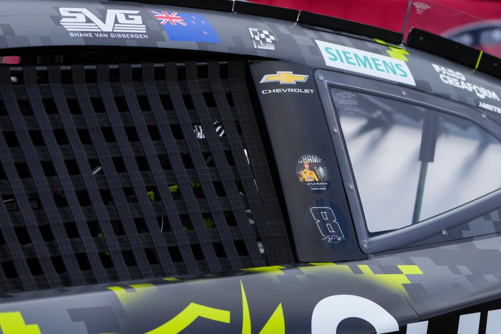 Decals are displayed on Shane Van Gisbergen's car in honor of late driver Kyle Busch prior to a NASCAR Cup Series auto race, Sunday, May 24, 2026, in Charlotte, N.C. (AP Photo/Matt Kelley)