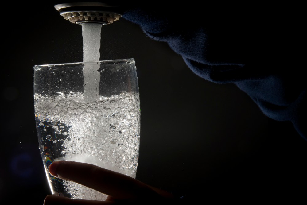 Drinking water is poured into a glass from a faucet in North Vancouver on July, 30, 2019. THE CANADIAN PRESS/Jonathan Hayward