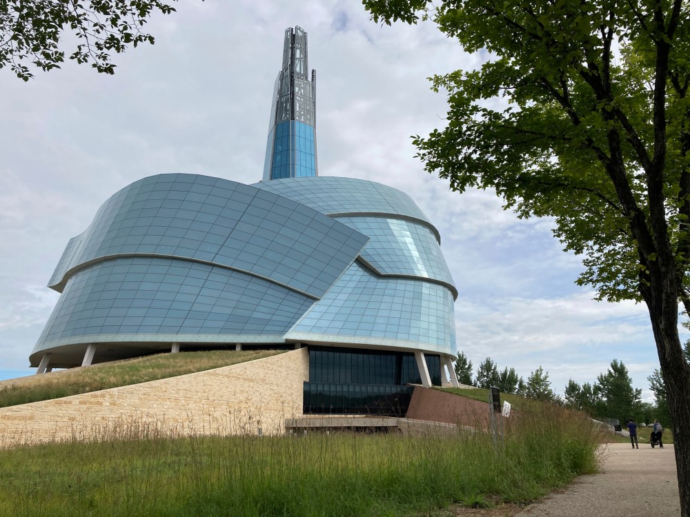 People walk by the Canadian Museum for Human Rights on Aug. 13, 2023, in Winnipeg, Manitoba. (AP Photo/Felicia Fonseca)