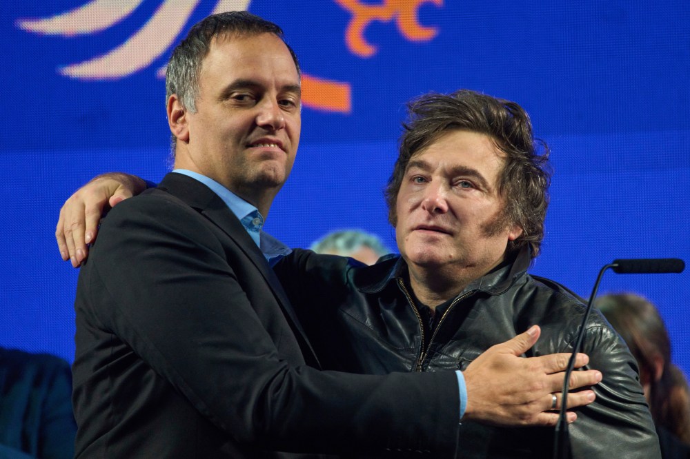 FILE - Argentina's President Javier Milei, right, embraces Manuel Adorni, a contender in the upcoming elections for the Buenos Aires city legislature, during the closing campaign rally in Buenos Aires, Argentina, Wednesday, May 14, 2025. (AP Photo/Rodrigo Abd, File)