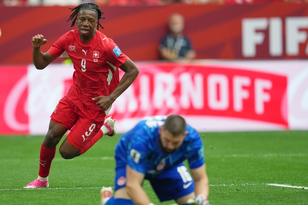 Switzerland's Johan Manzambi (9) celebrates after scoring as Canada goalkeeper Maxime Crepeau reacts during the World Cup Group B soccer match between Switzerland and Canada in Vancouver, British Columbia, Wednesday, June 24, 2026. (AP Photo/Abbie Parr)