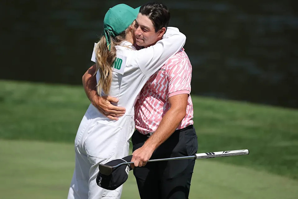 Viktor Hovland of Norway hugs Tuva Jensen on the ninth green during the Par Three Contest prior to the 2026 Masters Tournament at Augusta National Golf Club on April 8, 2026, in Augusta, Ga.Credit: Hector Vivas/Getty