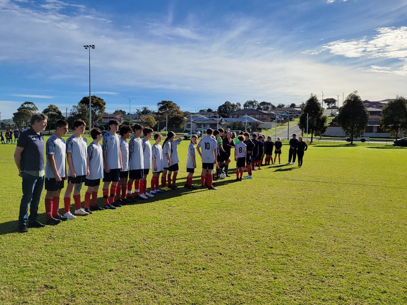 The teams are presented to Albany member Scott Leary. 