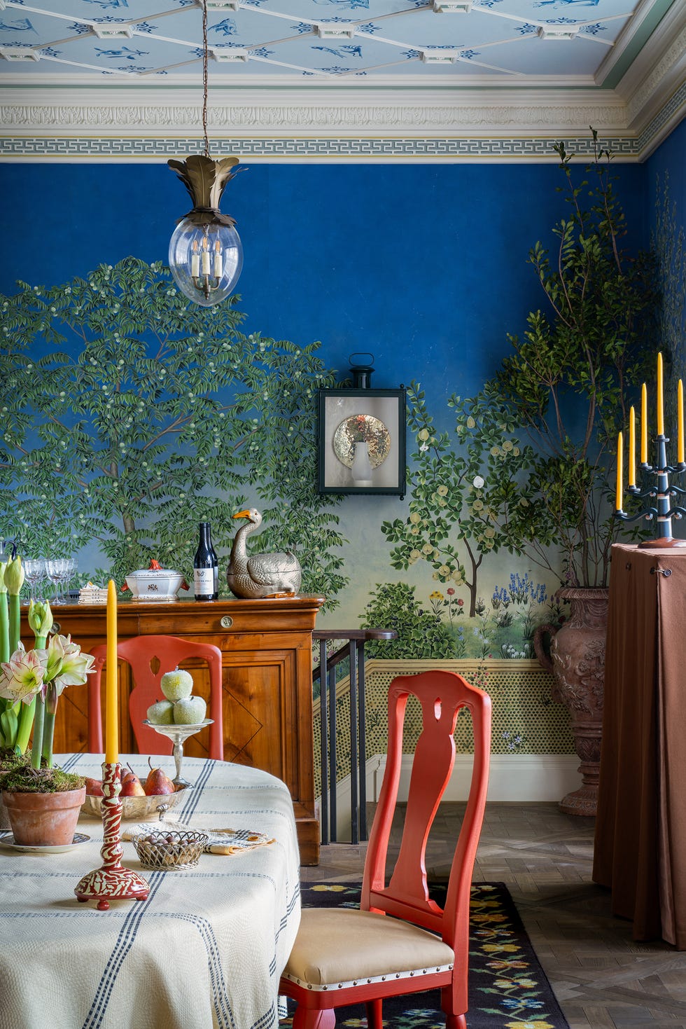 dining area with decorative elements and vibrant wall mural.