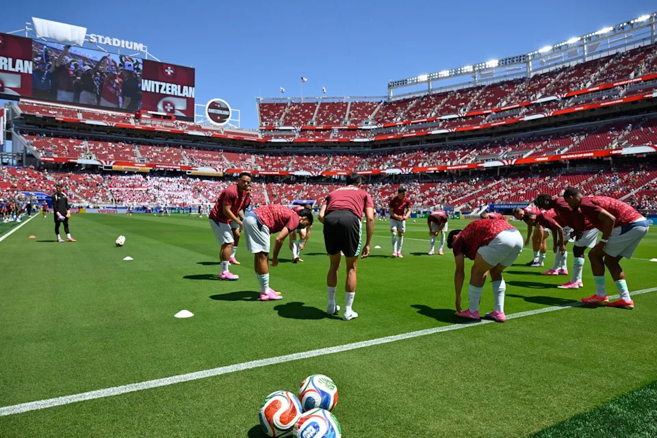 Members of the Swiss team warm up ahead of the start of the World Cup Group B soccer match between Qatar and Switzerland in Santa Clara, Calif., near San Francisco, Saturday, June 13, 2026. (AP Photo/Eakin Howard)