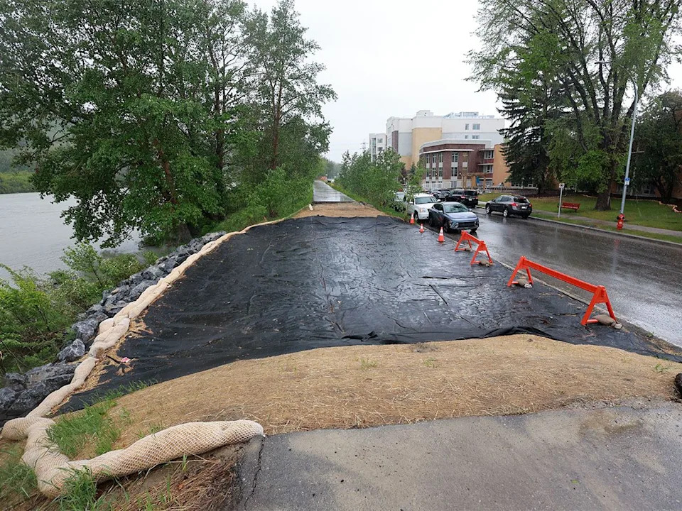 A section of flood protection berm temporarily removed near the Bow View Manor seniors residence in Montgomery has residents concerned as water rises in the nearby Bow River on Monday, June 1, 2026.