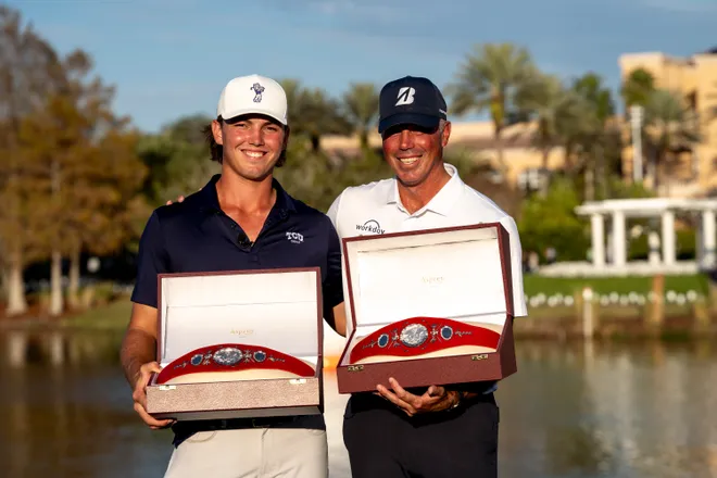 Cameron and Matt Kuchar pose with their winning belts at the PNC Championship.